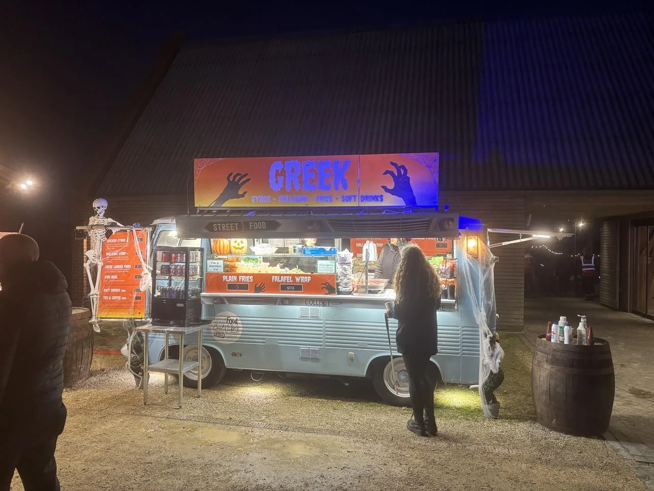 Halloween-themed vintage Greek van lit up at Wimpole Halloween Trail